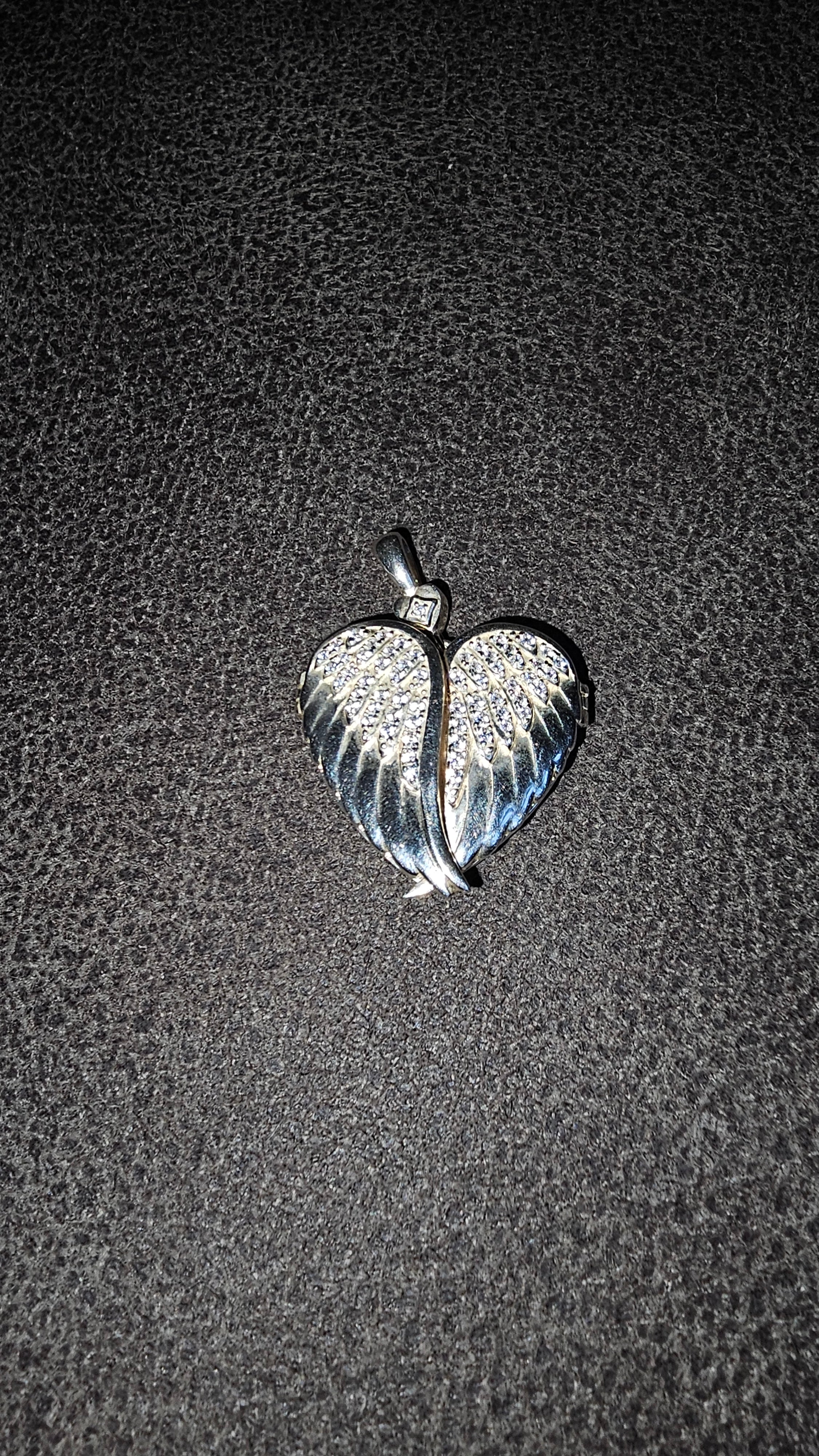 Beautiful heart shaped locket with wings to keep loved one’s ashes in and to be with you everywhere you go!