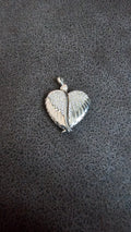 Beautiful heart shaped locket with wings to keep loved one’s ashes in and to be with you everywhere you go!