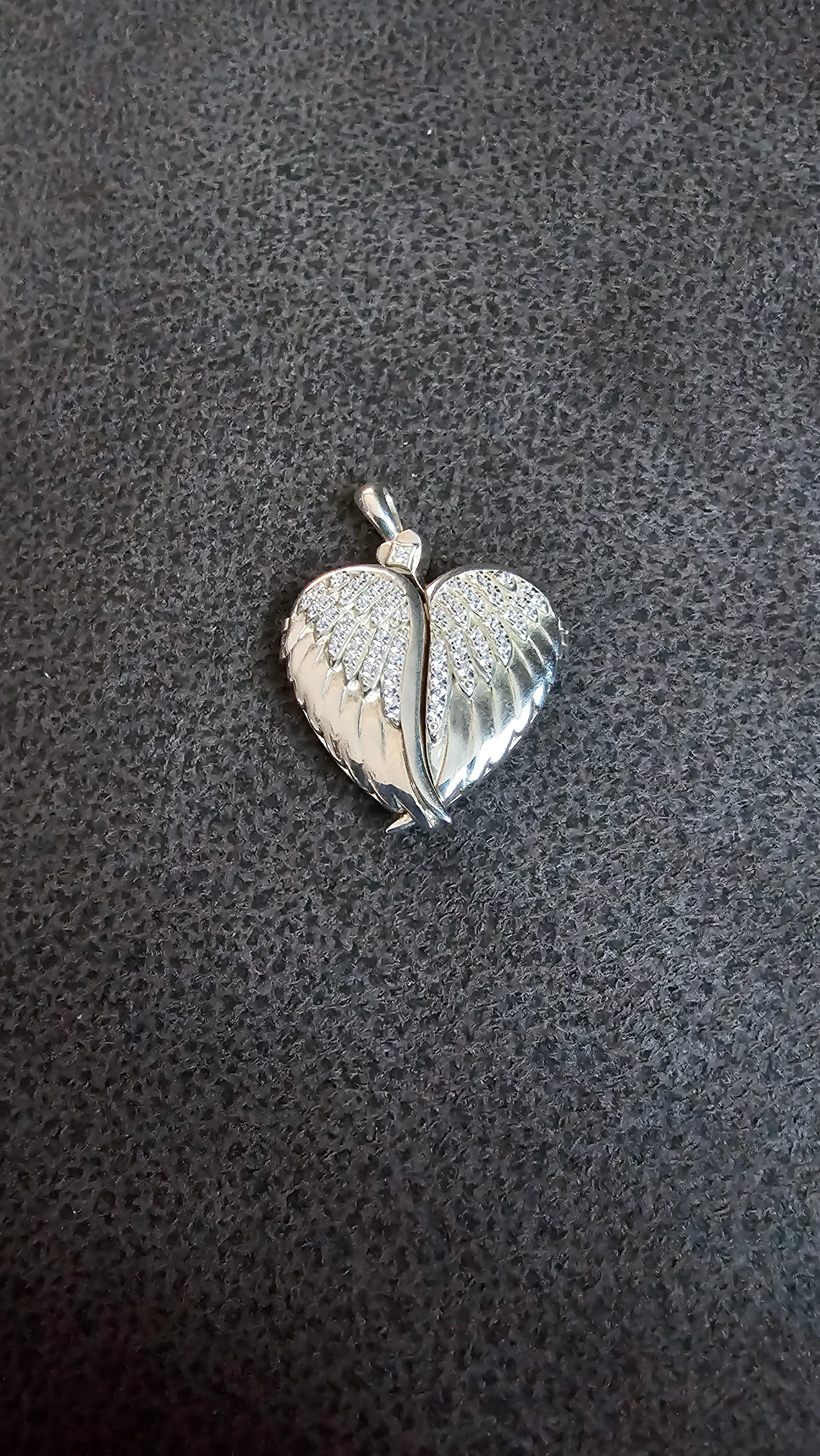 Beautiful heart shaped locket with wings to keep loved one’s ashes in and to be with you everywhere you go!