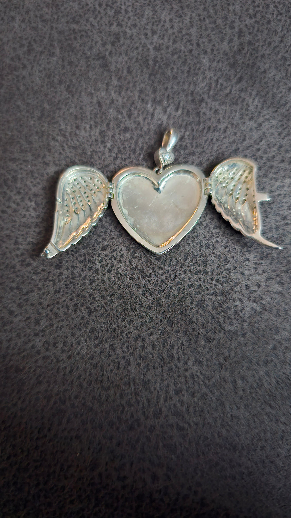 Beautiful heart shaped locket with wings to keep loved one’s ashes in and to be with you everywhere you go!