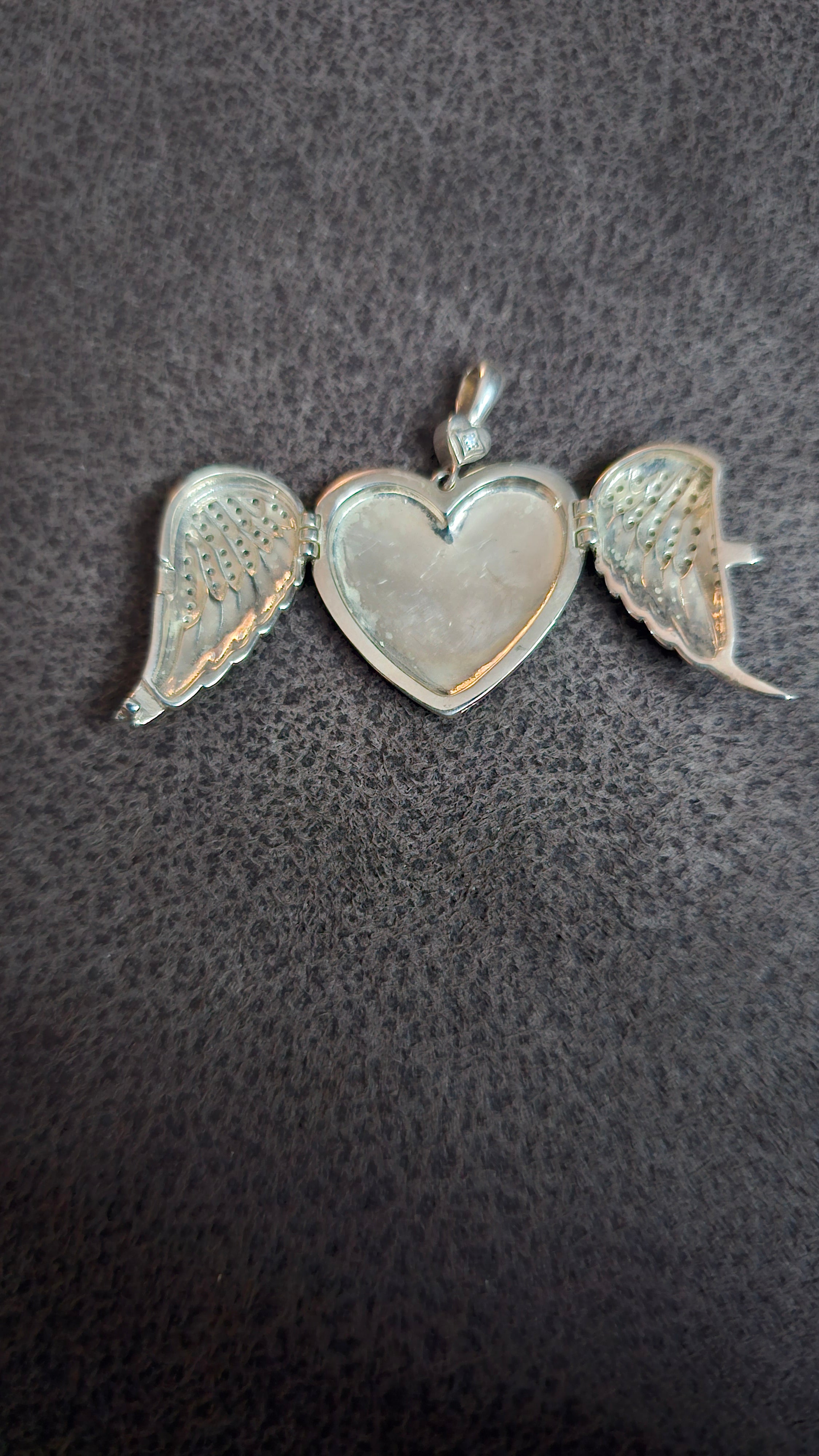 Beautiful heart shaped locket with wings to keep loved one’s ashes in and to be with you everywhere you go!